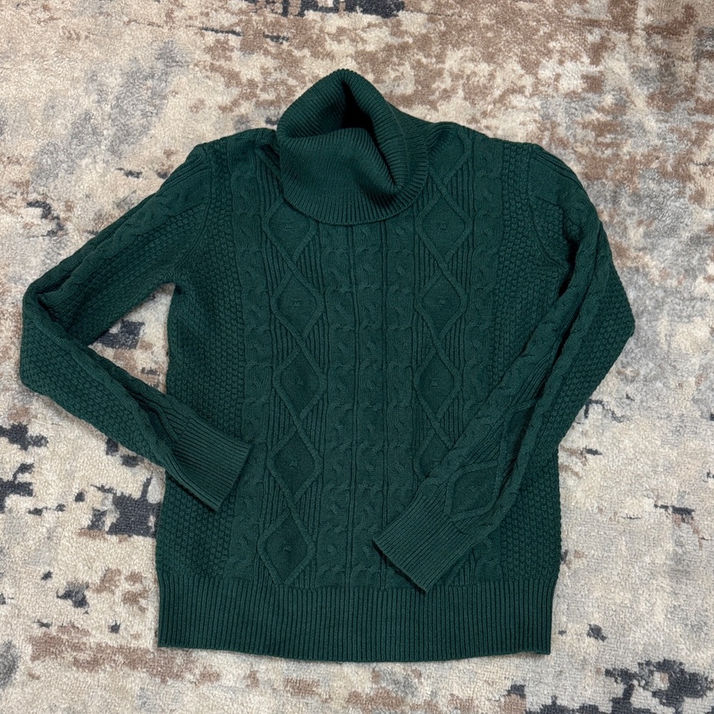Green cable knit turtleneck sweater